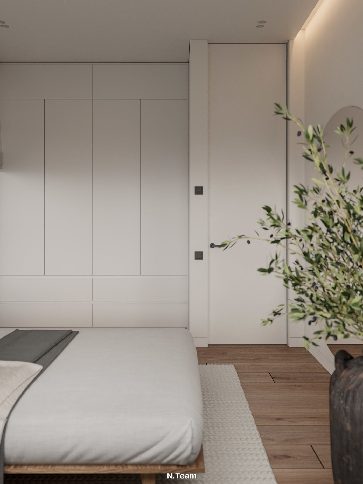 Tủ quần áo âm tường cùng tông trắng tạo cảm giác phòng ngủ rộng hơn