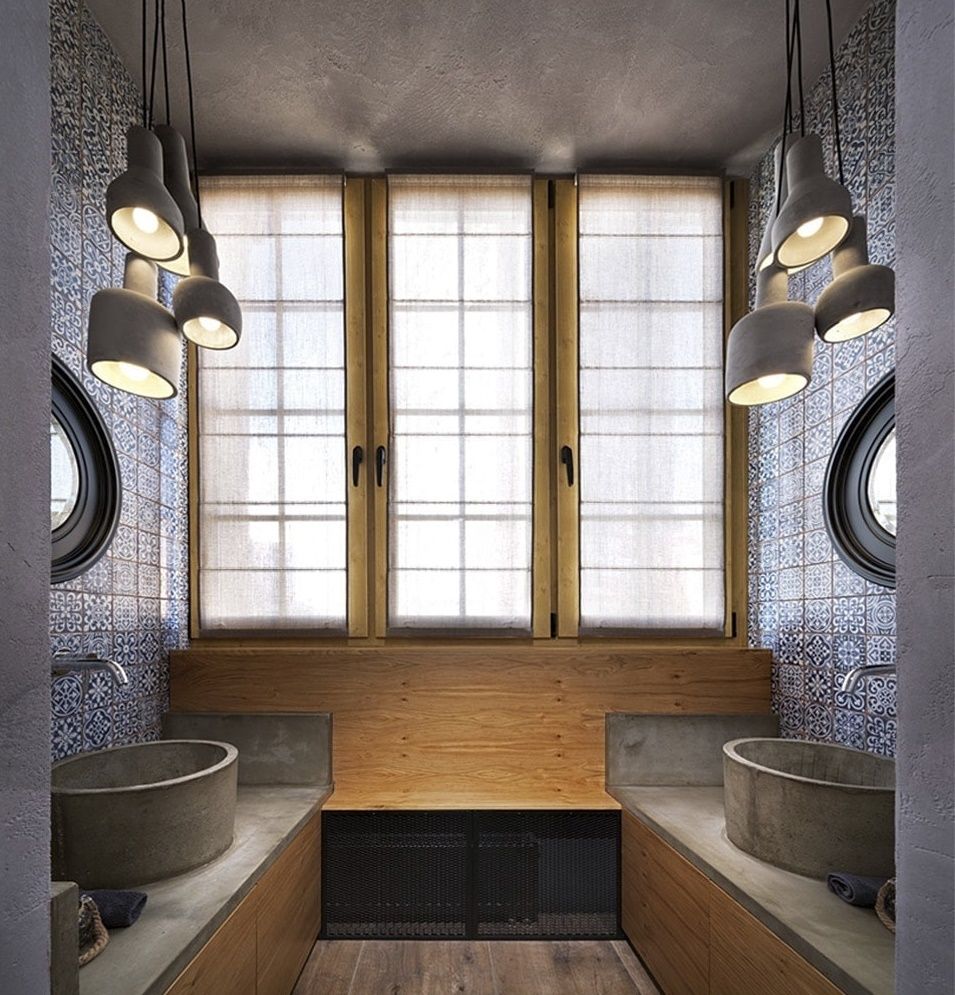 Phòng tắm sử dụng gạch lát họa tiết cùng bồn rửa bê tông