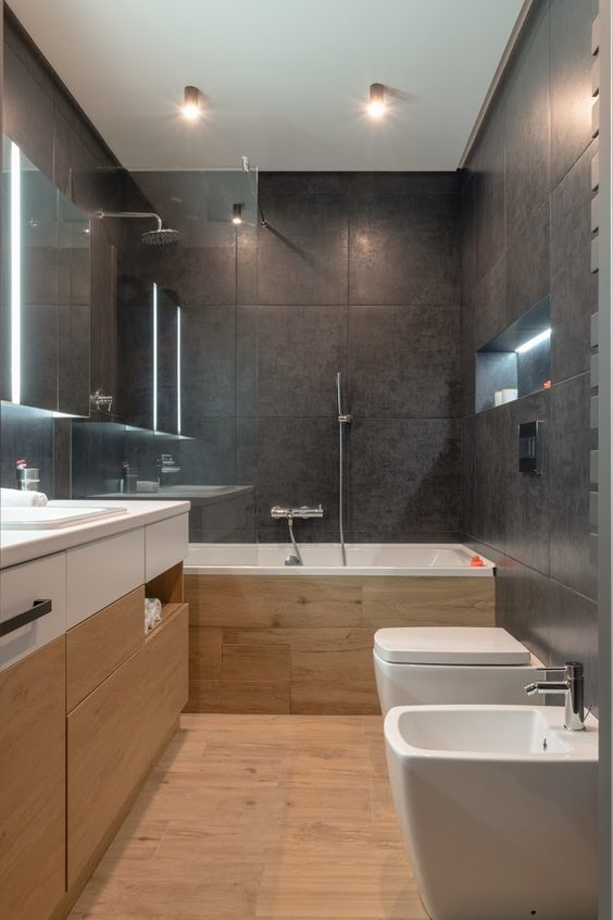 Phòng vệ sinh với tường gạch đá đen tăng thêm phần hiện đại, sang trọng